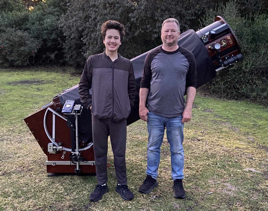 Father And Son Enjoy A Terrific Night Under The Stars - By The Beach
